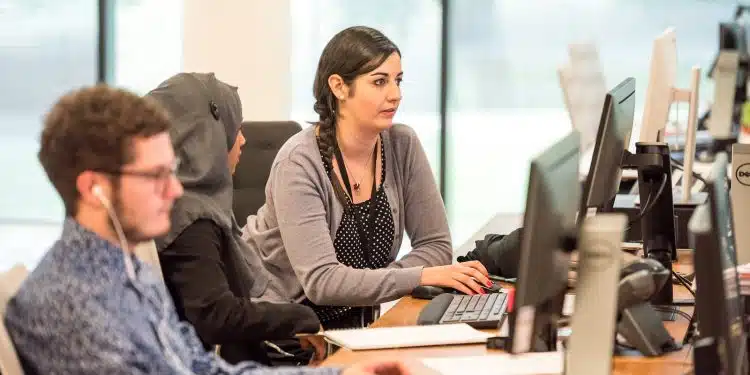 unknown persons using computer indoors